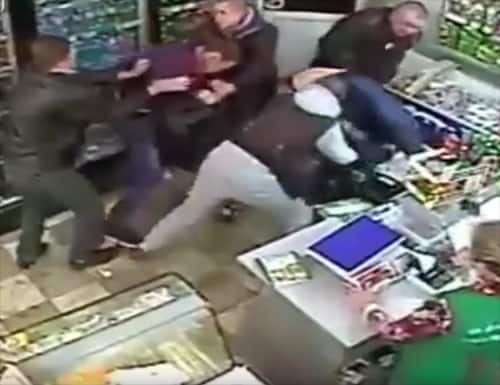 CCTV: Russian security guard deals with violent thugs