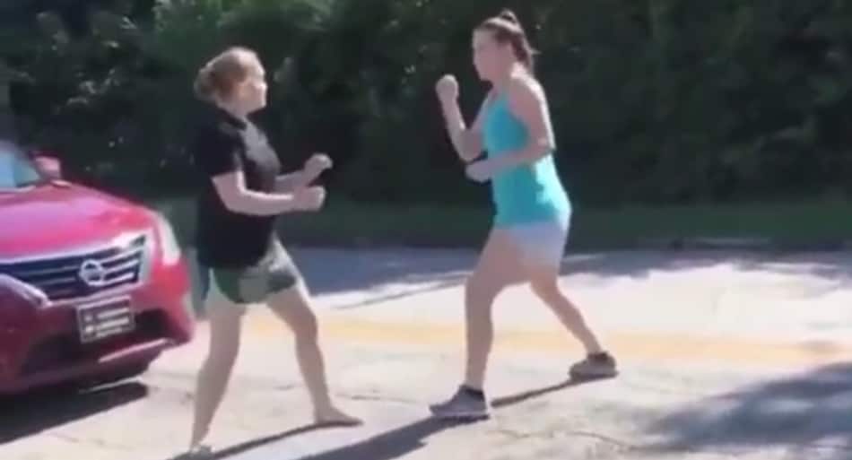 Girl puts on boxing CLINIC in road rage battle (NSFW)