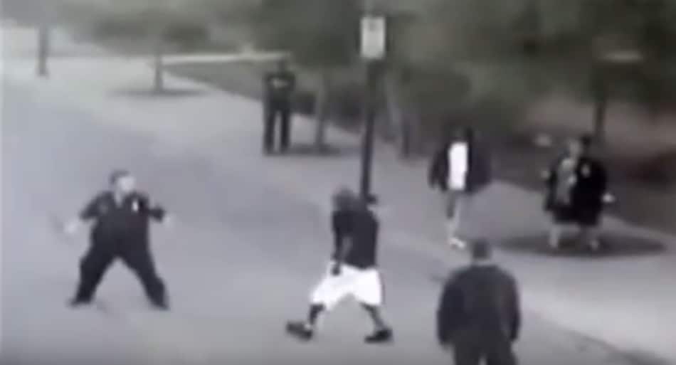 Guy attacks cop – homeless man steps in
