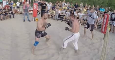 Karate fighter vs. street fighter in the sand