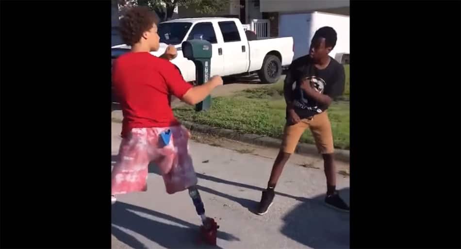 Kid removes prosthetic legs and lays the smack down