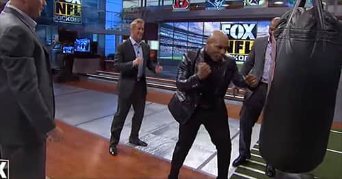 Mike Tyson shows Brian Urlacher how to throw a KO punch