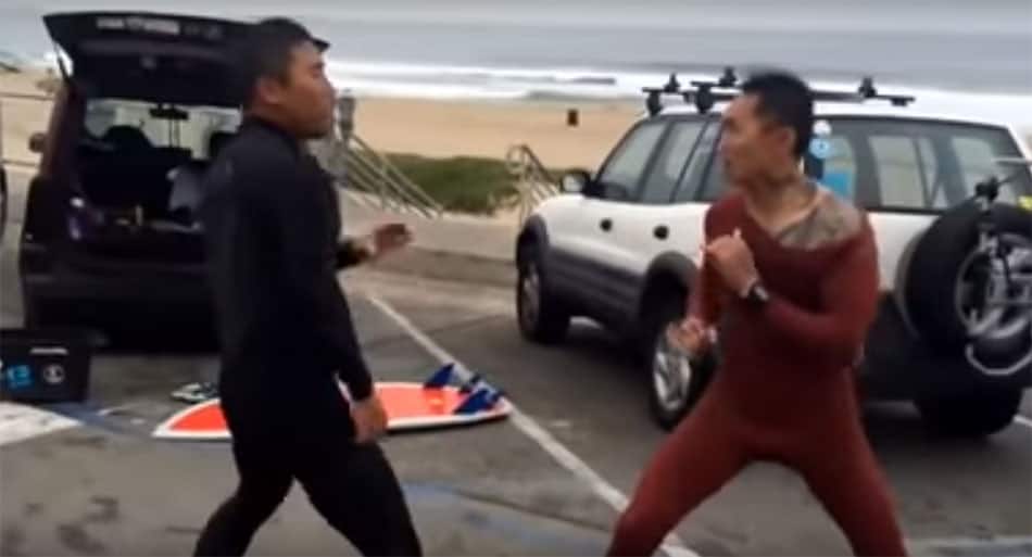 Surfers fighting over waves flows onto the street