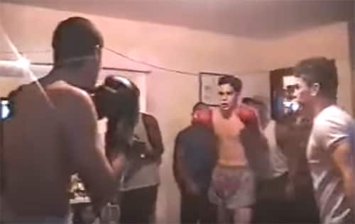 Young Mauricio Rua fighting Muay Thai in a living room